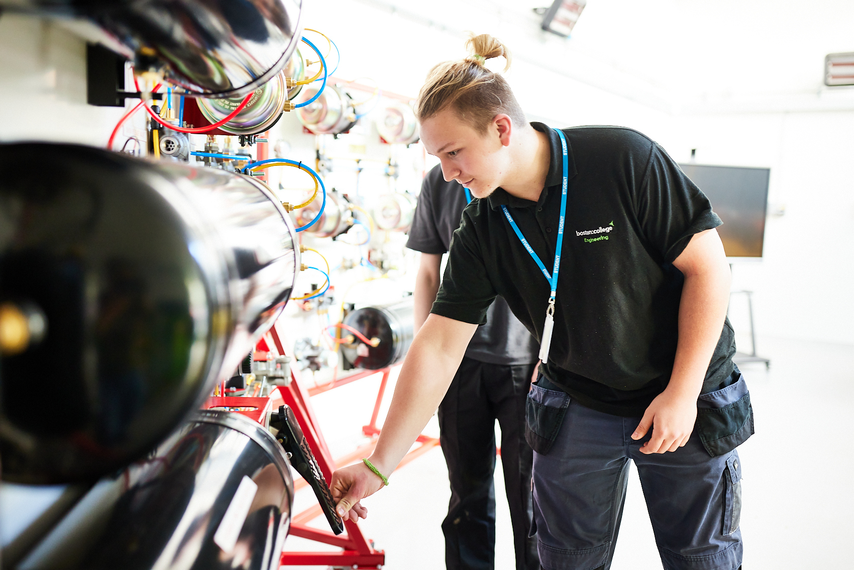 Student working machinery in the Engineering workshop.