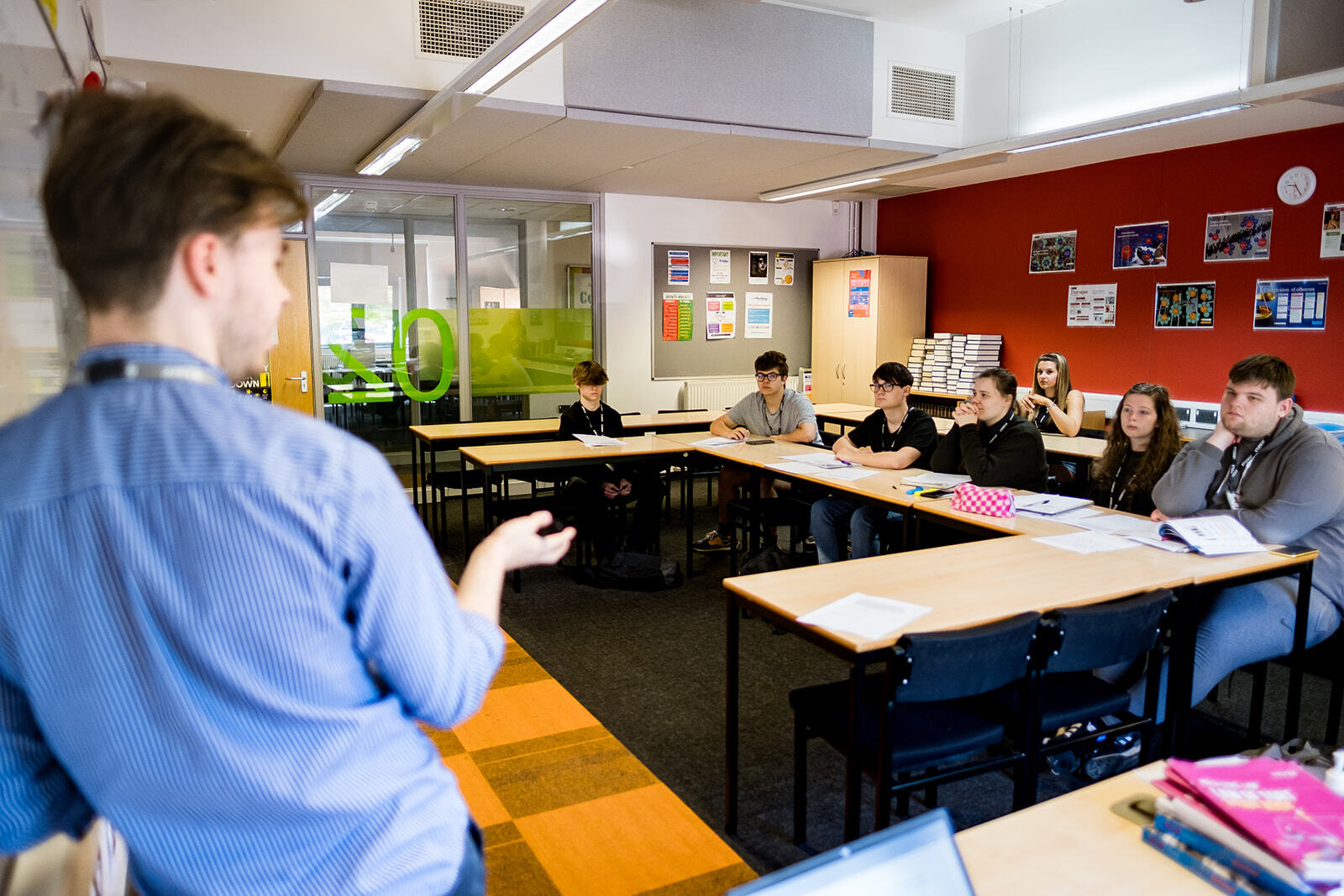 A person teaching a class of students.