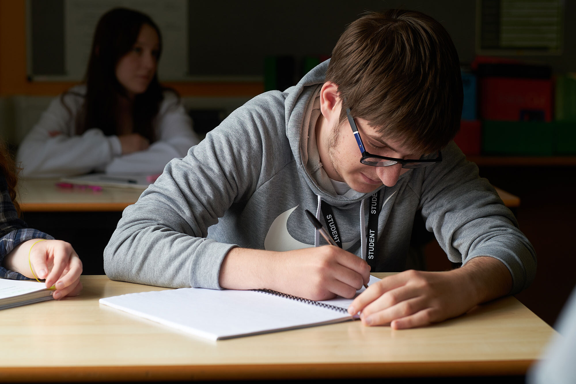 A student writing notes.