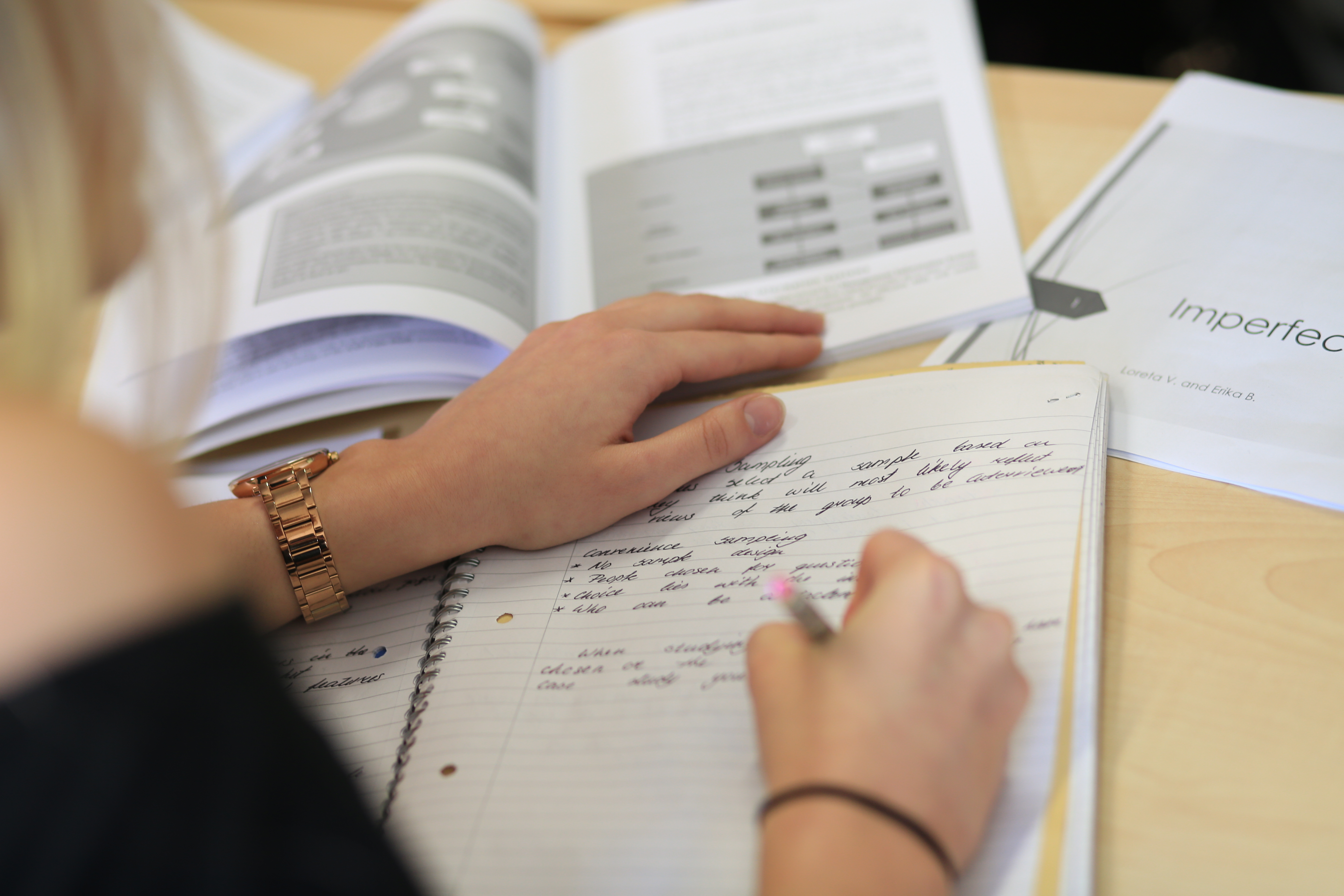 A student writing notes.