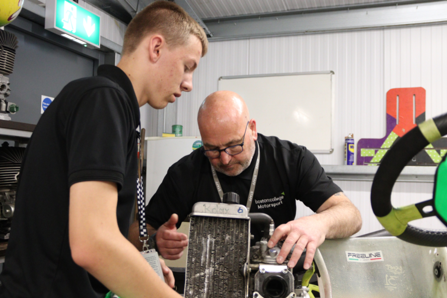 Student and Lecturer working on a go kart.