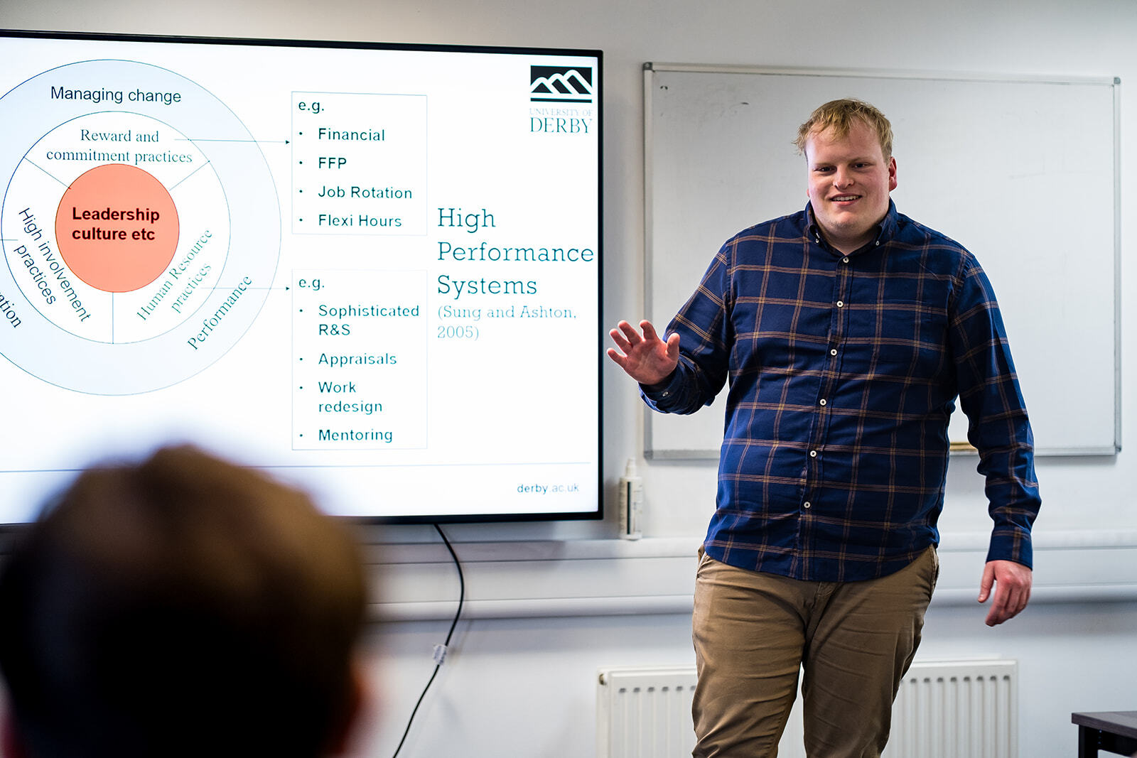 A student delivering a presentation.