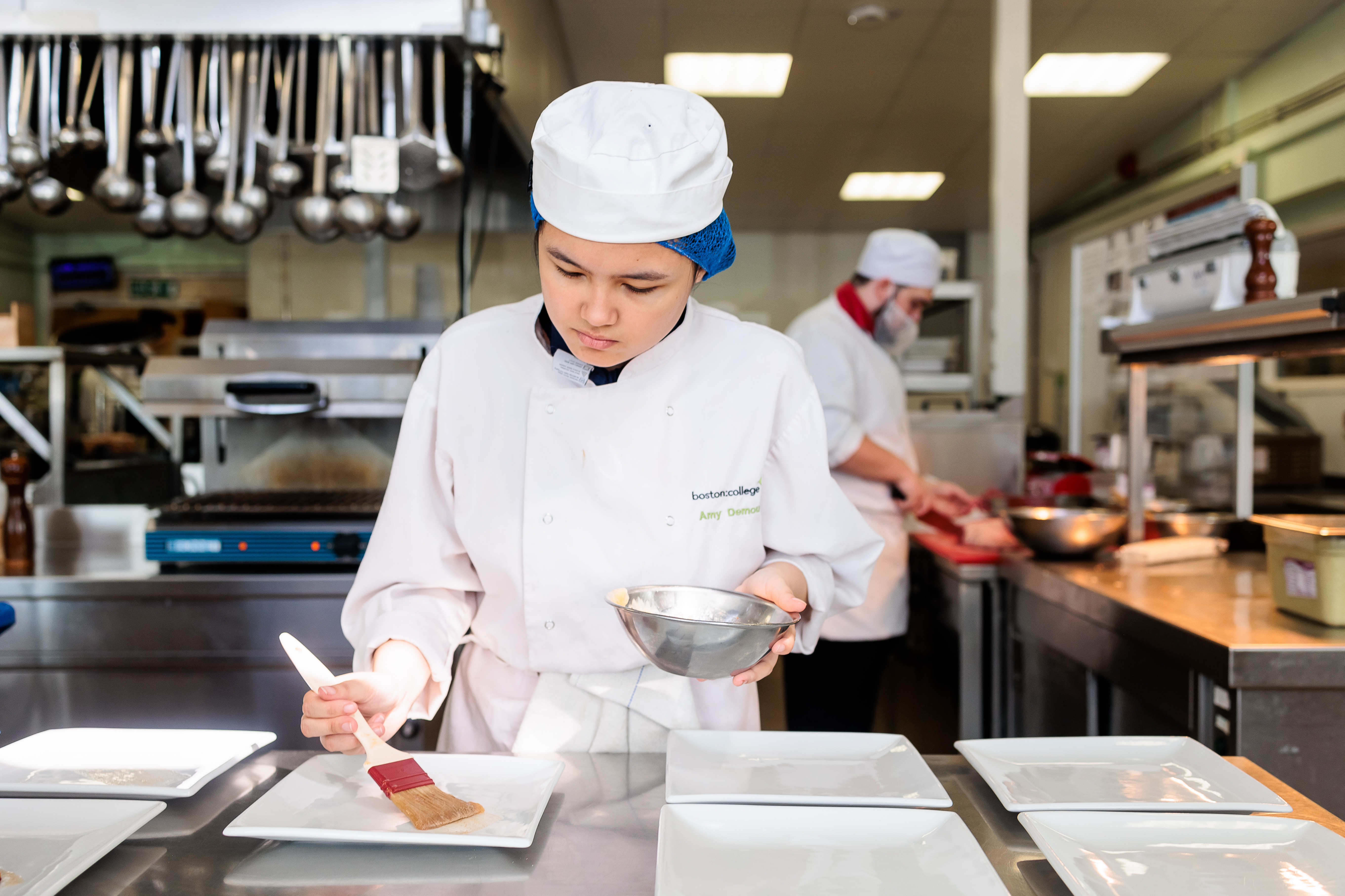 Student chef preparing food.
