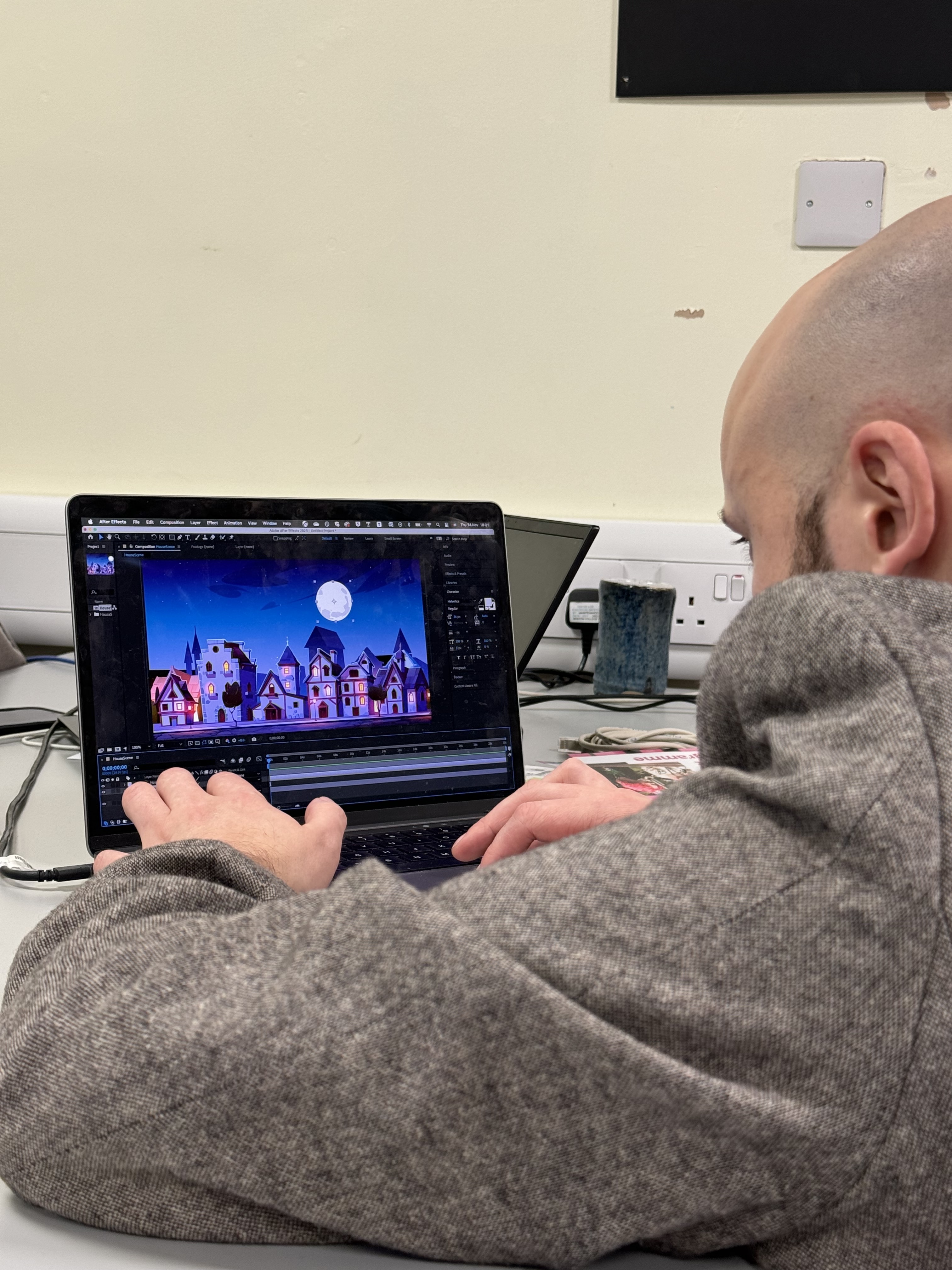 Person creating an animation on a laptop.