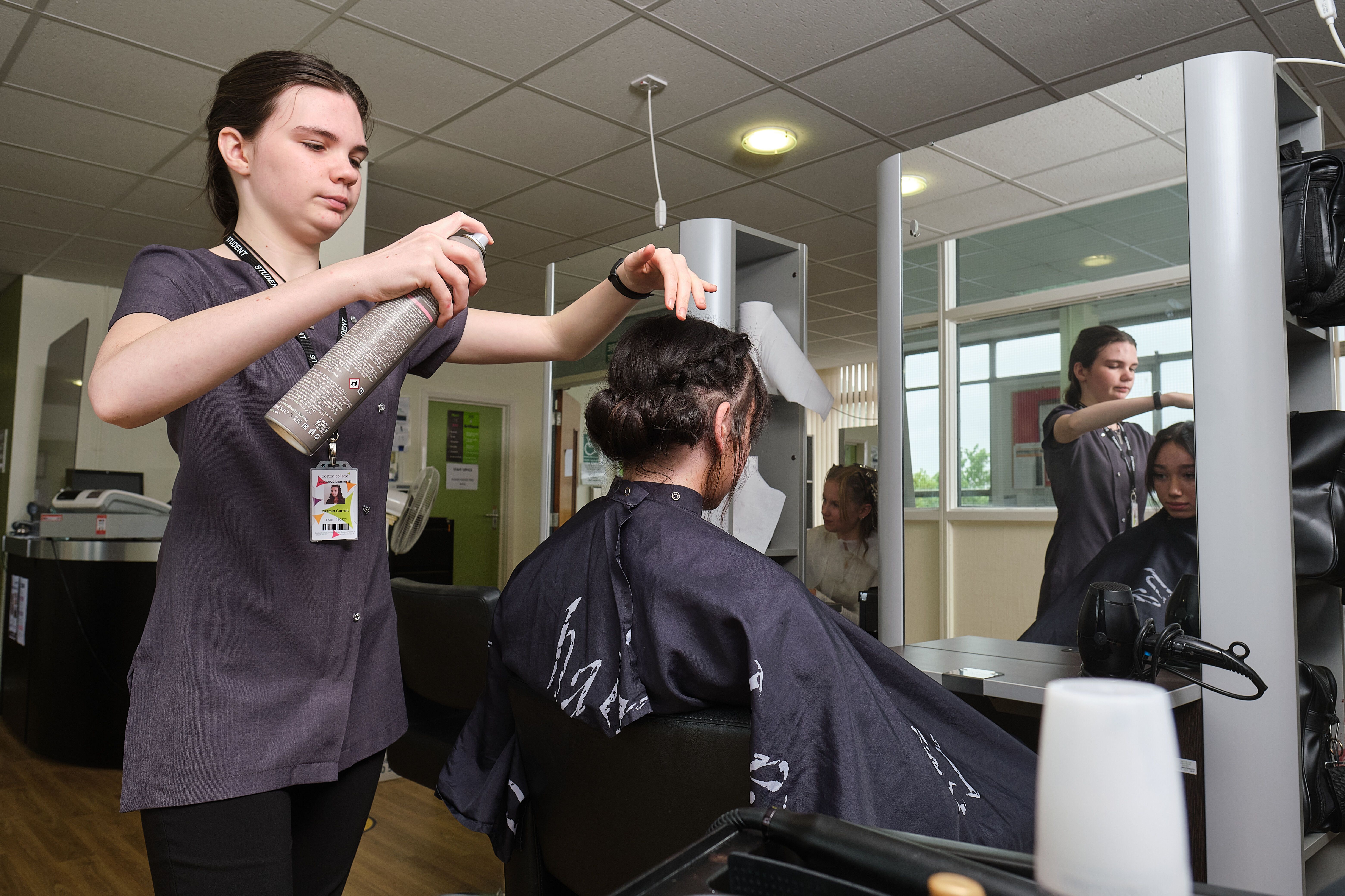 A student cutting hair in the salon.