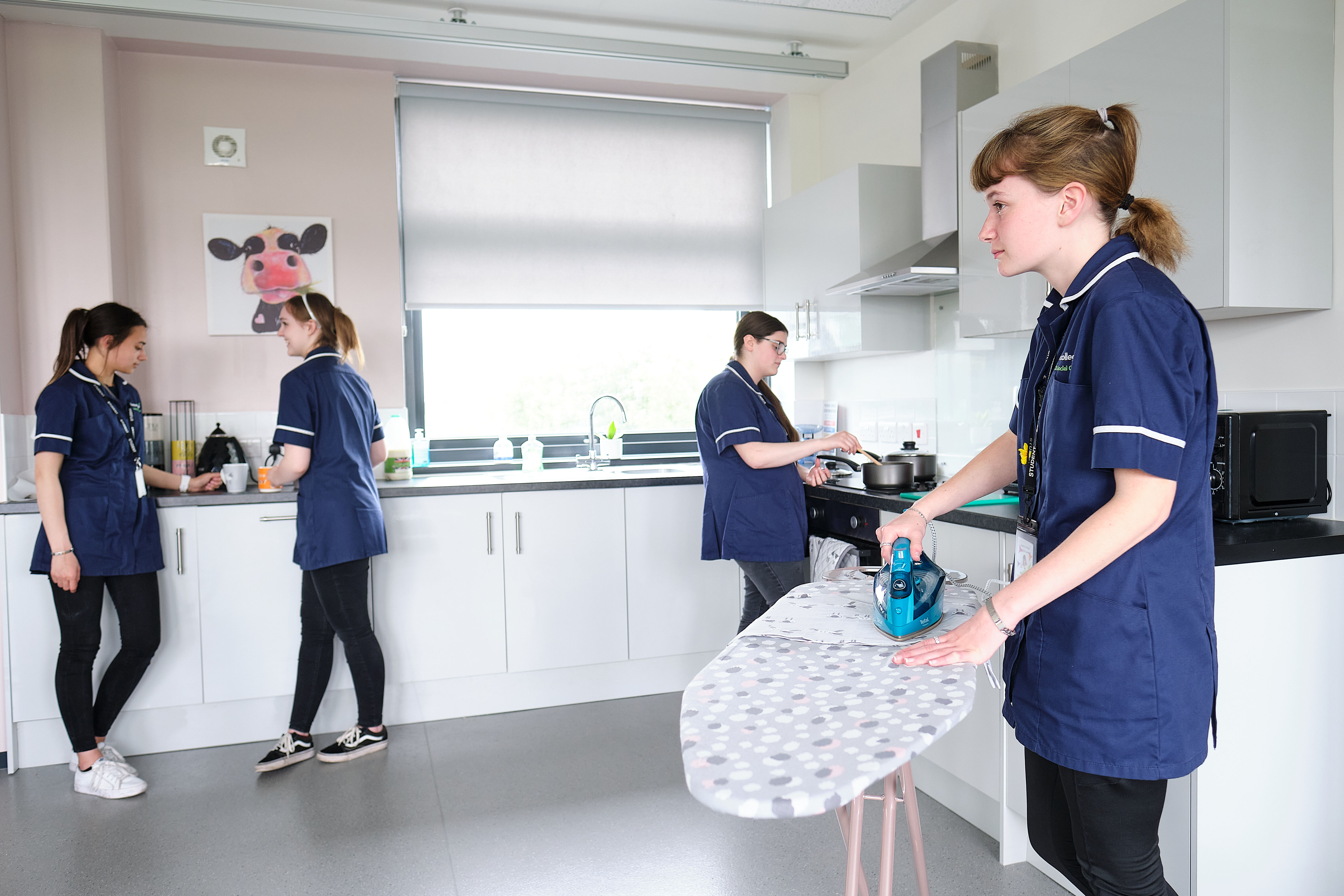 Health & Social Care students complete daily tasks such as ironing and washing up in the mock-independent living flat.
