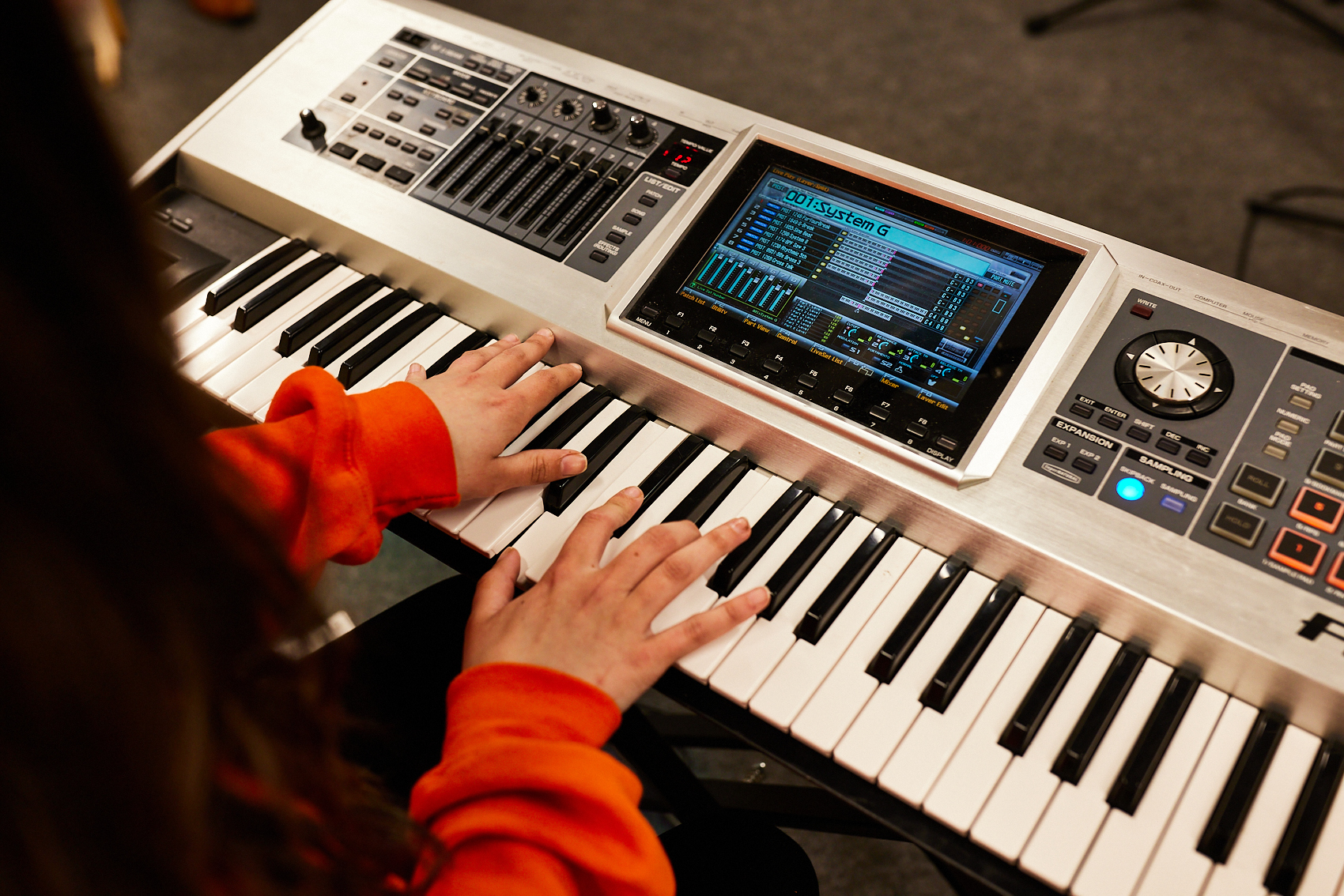 A student playing the keyboard.