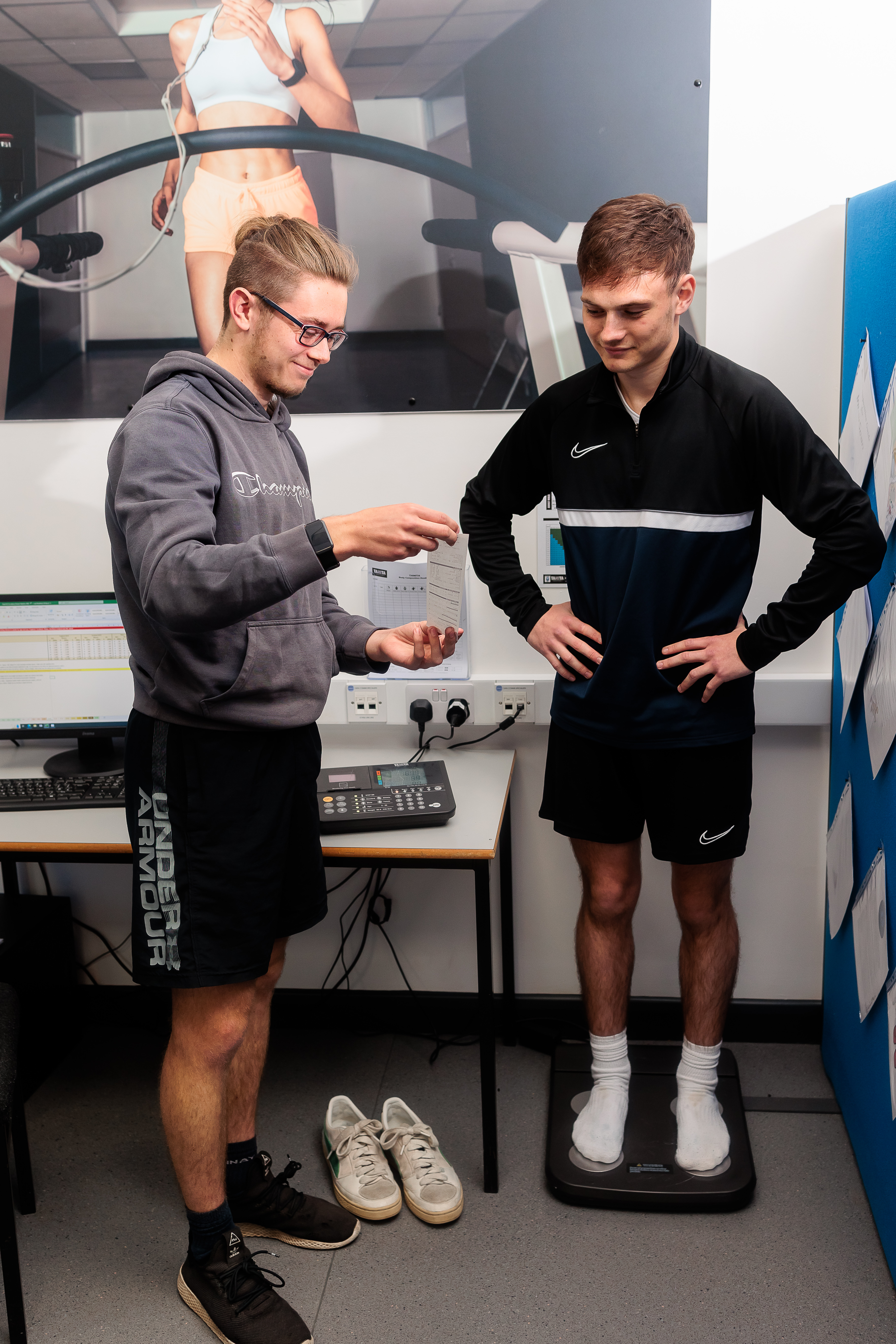Two students reviewing results from a fitness test.
