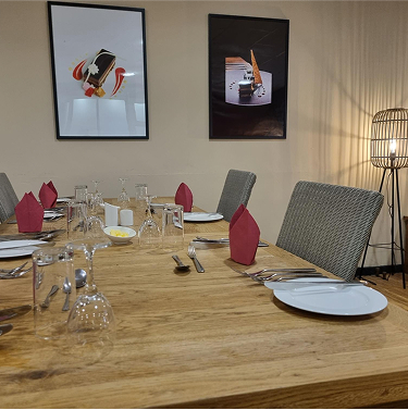 A restaurant with set tables.