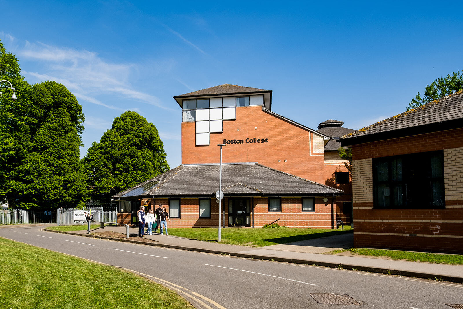 A building and road on Rochford Campus under blue skies.