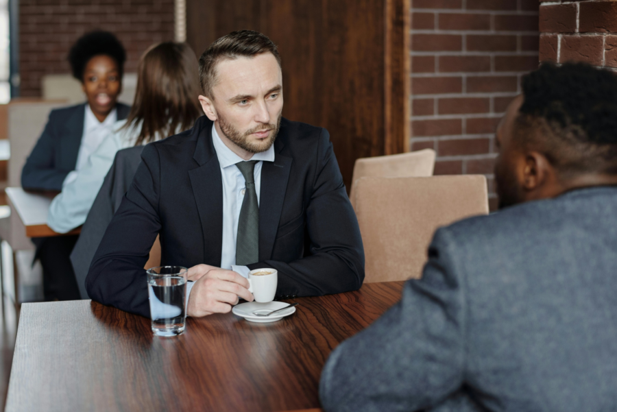 Pexels Image - Businessmen Having a Meeting at a Cafe