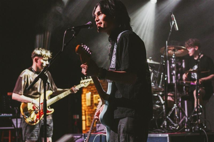 Student band performing on stage.