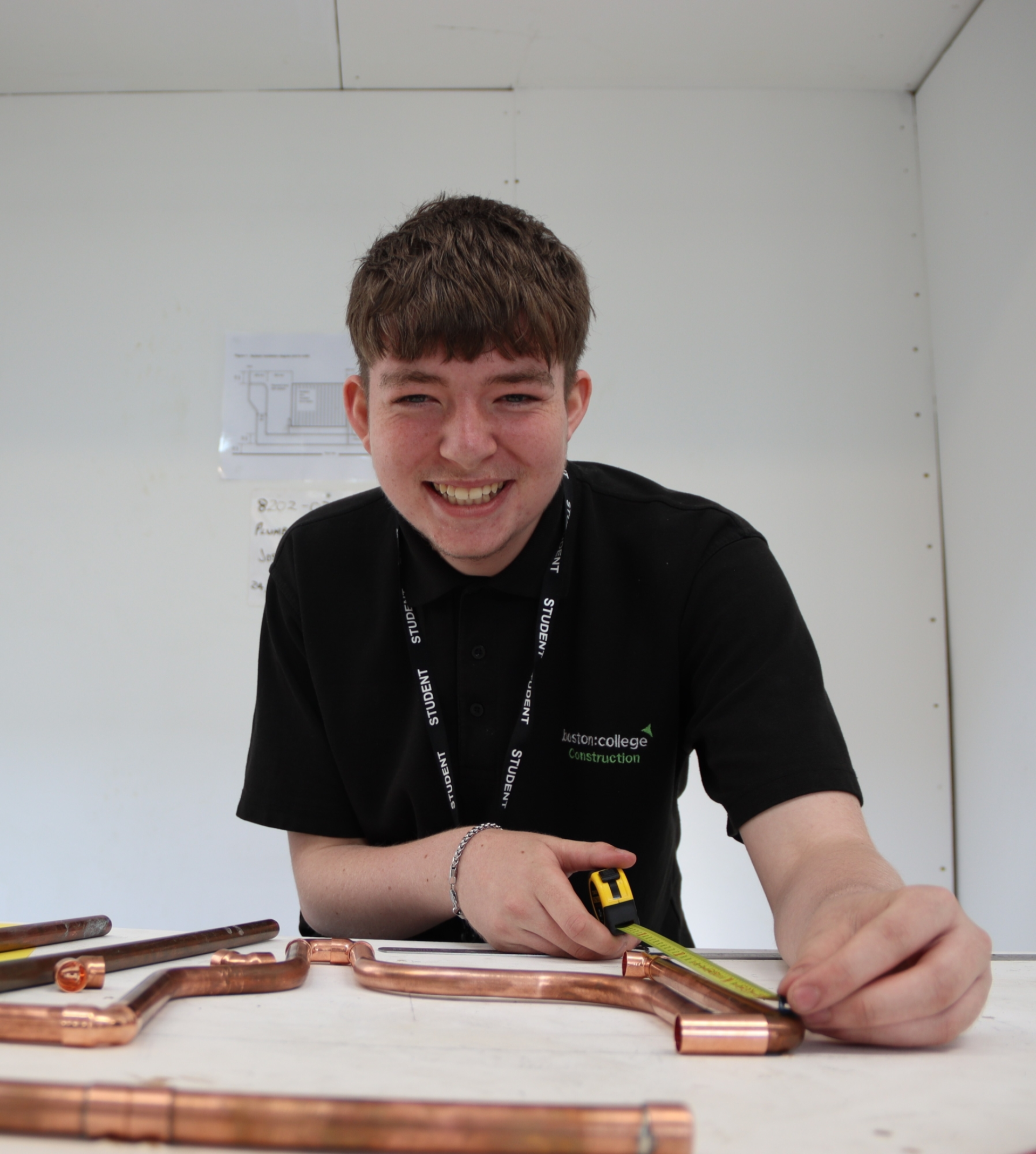 Student using a tape measure.