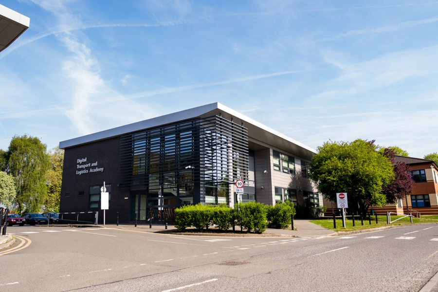 Exterior of the Digital, Transport and Logistics Hub under clear blue skies at Boston College.