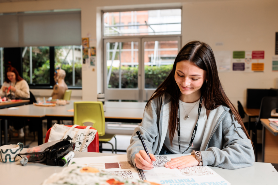 Art students working at their desks.