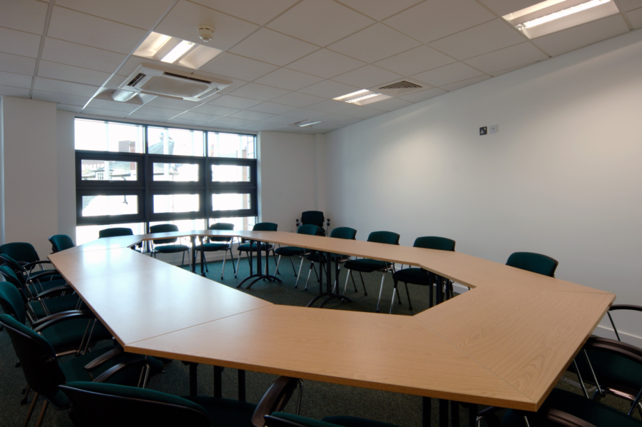 A conference room with a circular table.