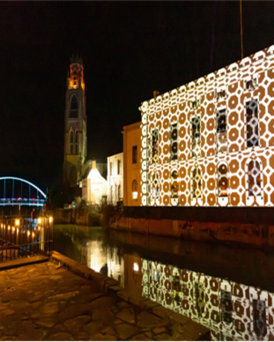 Town centre buildings lit up with colourful lights at Boston Brilliance.